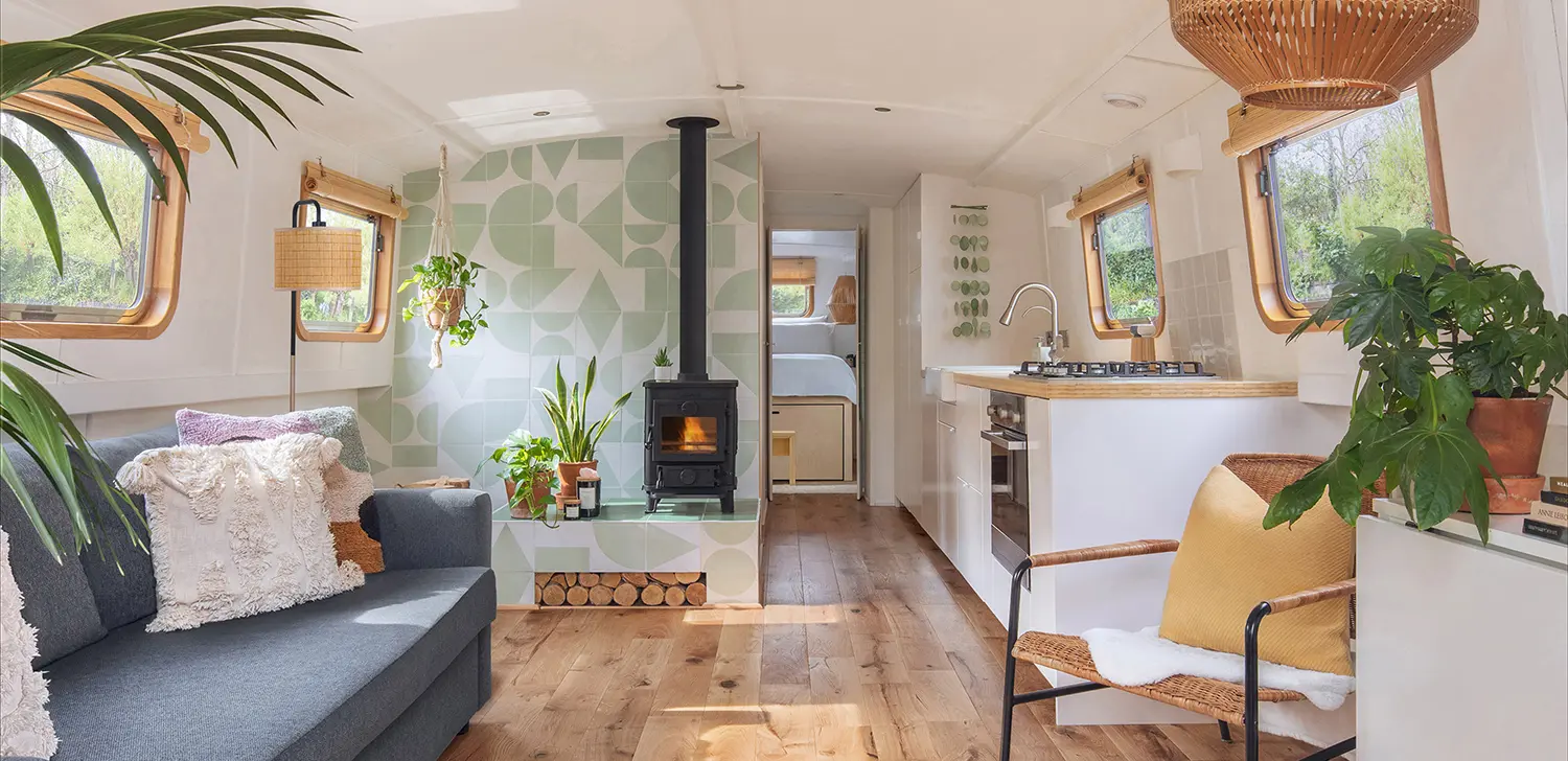 house boat interior design bromley london living room sofa wood burner green tile fireplace kitchen
