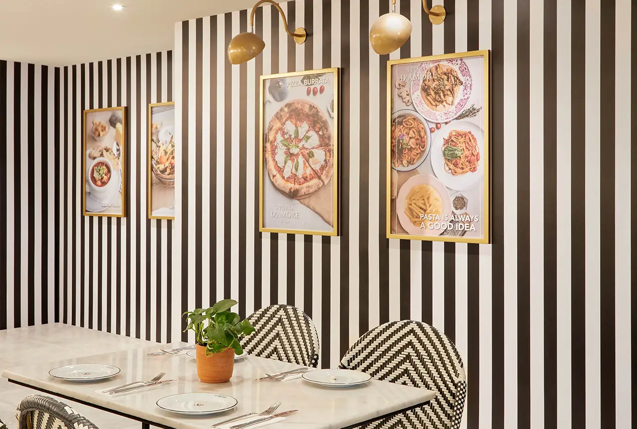 italian bistro dining nook interior design london striped wall menu frames