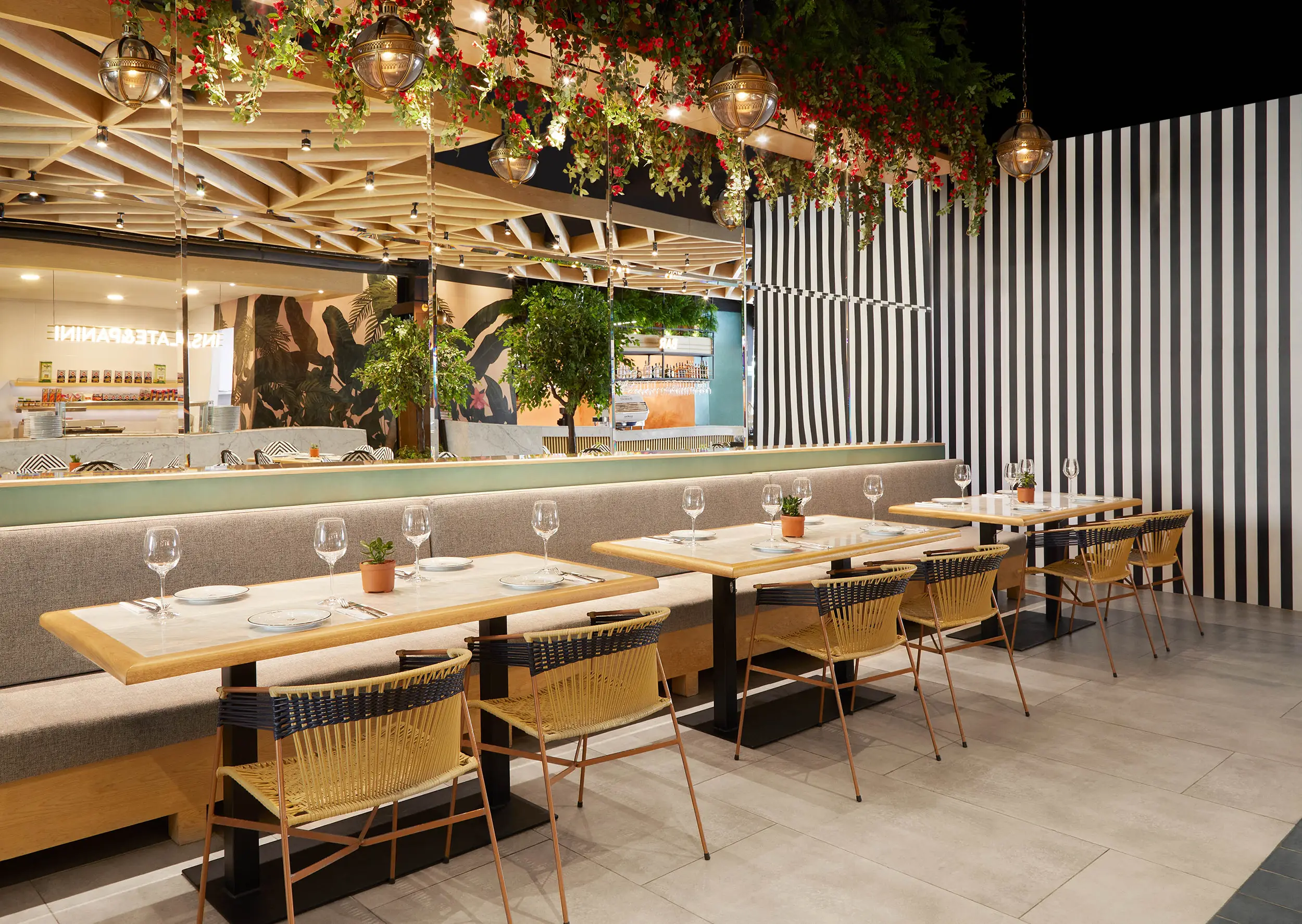 italian restaurant dining area interior design london rattan chairs hanging flowers