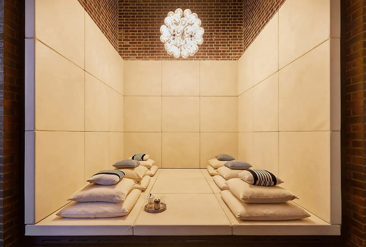 residential interior design relaxation nook brick ceiling chandelier london