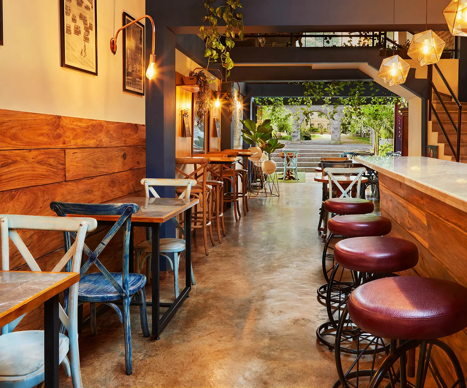 restaurant bar seating area wood paneling leather stools london