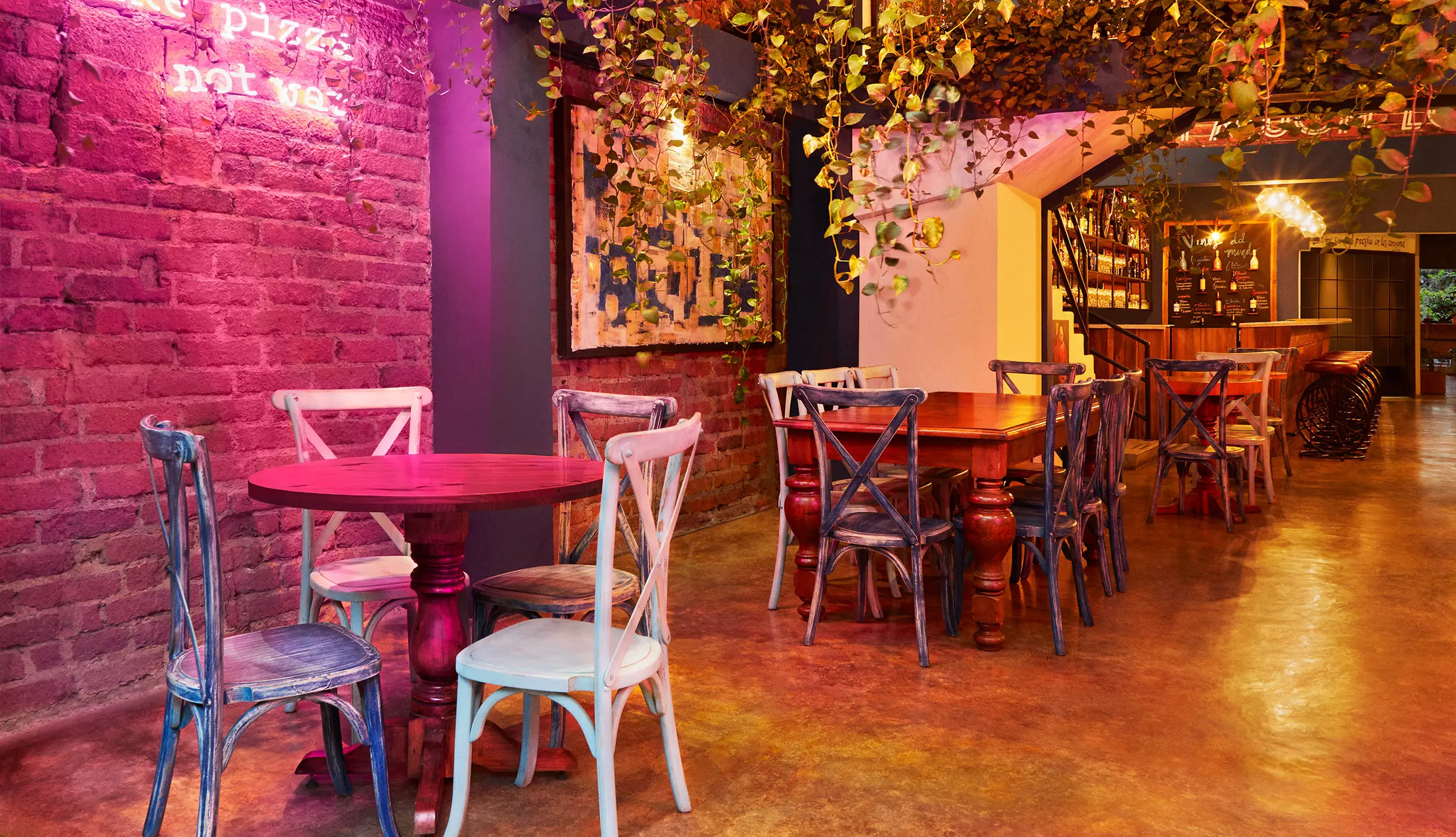 restaurant interior design pink brick wall neon sign dining area london